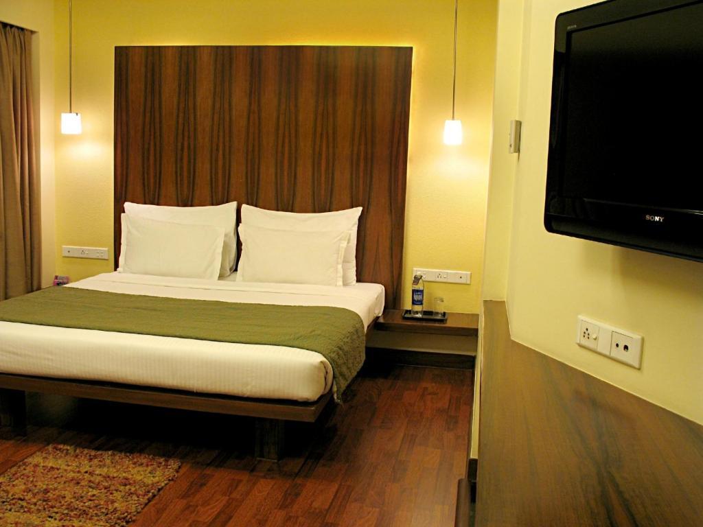 Hotel Studio Estique Pune Quarto foto