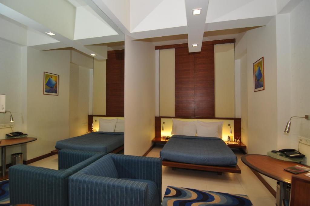 Hotel Studio Estique Pune Quarto foto